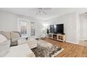 Bright living room features a comfortable sofa, large TV, and stylish decor at 106 Brighton Pt, Atlanta, GA 30328