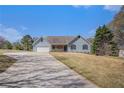 Lovely single-Gathering home featuring well-manicured lawn and attached garage at 45 Buckeye Cir, Covington, GA 30016