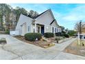 Charming single-Gathering home featuring well-maintained landscaping, symmetrical design, and inviting curb appeal at 3775 Pine Village Pl, Loganville, GA 30052