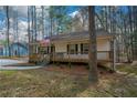 Attractive home with a large porch, perfect for enjoying a peaceful wooded setting at 98 Brenda Cir, Rockmart, GA 30153