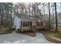 Cozy home with a spacious wooden porch, ideal for relaxing and enjoying the outdoors at 98 Brenda Cir, Rockmart, GA 30153