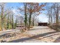 Spacious driveway and covered parking adjacent to a cozy home at 2655 Lakeside Trl, Cumming, GA 30041