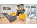 Cozy living room featuring a black brick fireplace and natural light at 6828 Lockridge Dr, Atlanta, GA 30360