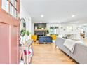 Inviting living room featuring wood floors, a decorative fireplace, and an open layout at 6828 Lockridge Dr, Atlanta, GA 30360