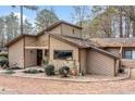 Charming home with wood siding, stone accents and professional landscaping with a winding walkway to the covered front entrance at 812 Bonnie Glen Se Dr, Marietta, GA 30067