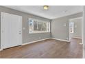 Bright living room with wood floors, a large window, and neutral paint at 1883 Clarke Ln, Decatur, GA 30035