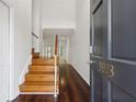 Inviting entryway with hardwood floors and staircase leading to the upper level at 3923 Ashford Lake Ne Ct, Brookhaven, GA 30319