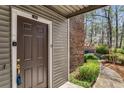 Front door entrance to condo unit with keyless entry at 102 Barrington Hills Dr, Atlanta, GA 30350