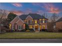 Charming brick two-story home has a beautifully manicured lawn and lush landscaping at 5321 Whitehaven Park Se Ln, Smyrna, GA 30082