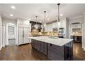 Beautiful kitchen with stainless steel appliances, large center island, and custom cabinets at 5321 Whitehaven Park Se Ln, Smyrna, GA 30082