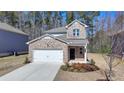 Charming two-story home with brick accents and a well-manicured front yard, perfect for a Gathering at 1659 Hay Patch Ln, Loganville, GA 30052