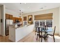 Bright dining area featuring a glass table and wood chairs, illuminated by natural light from nearby windows at 1430 Dresden Ne Dr # 200, Atlanta, GA 30319