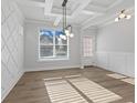 Bright dining room features a tray ceiling and decorative wall accents at 4190 Hosch Reserve Dr, Buford, GA 30519