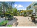 Spacious backyard patio with seating areas and lush landscaping, perfect for outdoor entertaining and relaxation at 4635 High Point Rd, Atlanta, GA 30342