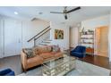 Bright living room featuring hardwood floors, comfortable seating and natural light at 6601 Cadence Blvd, Atlanta, GA 30328