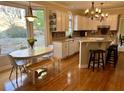 Bright kitchen with white cabinetry, granite countertops, stainless appliances, and breakfast nook at 272 Lynshire Sw Ct, Marietta, GA 30064