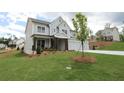 Lovely home with a well-manicured lawn and landscaping, enhancing its curb appeal at 444 Lower Shoreline Ct Sw, Marietta, GA 30064