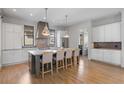 Beautiful kitchen with a center island, stainless steel appliances, and ample storage at 6845 Wesley Hughes Rd, Cumming, GA 30040