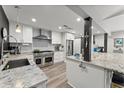 Modern, eat-in kitchen with stainless steel appliances, granite countertops and white cabinets at 10070 Timberstone Rd, Johns Creek, GA 30022