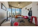 Bright living room with floor to ceiling windows showcasing city views and wood floors at 860 Peachtree Ne St # 1511, Atlanta, GA 30308