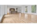 Bright, open-concept living space with hardwood floors and an eat-in kitchen featuring a marble countertop island at 98 Sheridan Dr, Atlanta, GA 30305