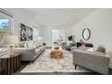 Bright and airy living room featuring large windows, recessed lighting, and comfortable seating at 510 Ponce De Leon Ne Mnr, Atlanta, GA 30307