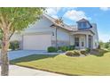 Charming home with well-maintained lawn, stone accents, two-car garage, and inviting curb appeal at 5638 Maple Bluff Way, Hoschton, GA 30548