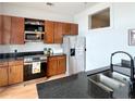 Modern kitchen with stainless steel appliances, granite countertops, and wooden cabinetry at 2630 Talley St # 426, Decatur, GA 30030