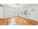 Bright dining area with hardwood floors, modern lighting, and large windows providing natural light at 793 Joseph E Boone Nw Blvd, Atlanta, GA 30314