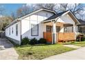 A beautiful front view of a home with a horizontal wood-slat porch fence, and easy driveway access at 793 Joseph E Boone Nw Blvd, Atlanta, GA 30314