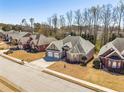 A quiet street featuring charming brick homes, mature trees, and well-manicured lawns at 1913 Shenley Park Ln, Duluth, GA 30097