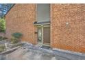 Welcoming brick exterior featuring a covered entryway and landscaped surroundings at 2459 Cedar Canyon Se Ct, Marietta, GA 30067
