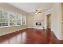 Bright living room features hardwood floors, a fireplace, and large windows at 1717 N Decatur Ne Rd # 121, Atlanta, GA 30307