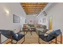 Comfortable living room with a cozy sectional sofa and exposed ceiling at 1846 Liberty Ln, Roswell, GA 30075
