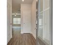 Inviting entryway with wood-look flooring and a view to the bright living area, showcasing a seamless transition at 4544 Eastbrook Pl, Snellville, GA 30039
