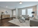 Comfortable living room with hardwood floors, neutral walls, and a stylish rug at 6596 Aria Village Dr # 642, Atlanta, GA 30328