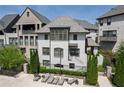 Exterior of home shows landscaped grounds and lounge area near a community pool at 6739 Encore Blvd, Atlanta, GA 30328