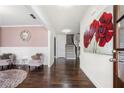 Inviting foyer with hardwood floors, an eye-catching mirror, and a floral painting at 144 Still Pine Bnd, Smyrna, GA 30082