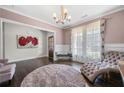 Living room features a plush chaise lounge, dark floors, and natural light at 144 Still Pine Bnd, Smyrna, GA 30082
