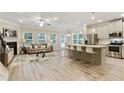 Open floor plan showcasing the living room and kitchen area with stainless steel appliances at 2623 Bloom Cir, Tucker, GA 30084