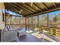 Relaxing screened-in porch with comfortable seating, perfect for enjoying the outdoors at 8445 Vernon Grove Rd, Chattahoochee Hills, GA 30268