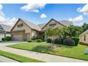 Beautiful home with a well-maintained lawn, lush landscaping, and inviting curb appeal at 110 Mountain Laurel Ct, Canton, GA 30114