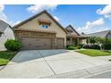 Stylish home featuring a spacious driveway, manicured lawn, and appealing exterior design at 110 Mountain Laurel Ct, Canton, GA 30114