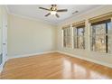 Bright, spacious bedroom featuring hardwood floors and multiple windows at 2782 Laurel Valley Trl, Buford, GA 30519