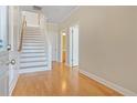 Inviting entryway with hardwood floors and staircase leading to upper level at 2782 Laurel Valley Trl, Buford, GA 30519