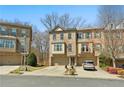 Attractive townhome complex features brick facade, individual driveways and garages at 2782 Laurel Valley Trl, Buford, GA 30519