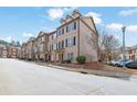 Beautiful townhome community with tree-lined streets and well-kept exteriors at 1952 Appaloosa Mill Cir, Buford, GA 30519