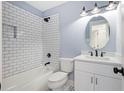 Updated bathroom with subway tile in shower, new vanity and fixtures at 5225 Maple Valley Sw Rd, Mableton, GA 30126
