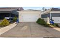Detached two-car garage with a large driveway and mature landscaping at 4121 N Swann St, Covington, GA 30014