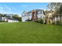 Suburban two-story home with a well-maintained lawn and a blue sky backdrop at 15 Glen Echo Dr, Covington, GA 30016